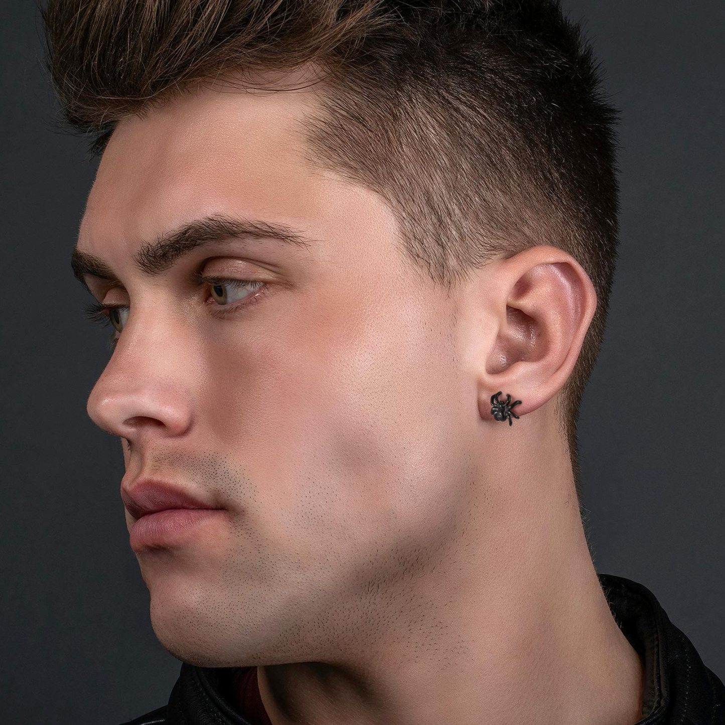 a men wearing Spider Stud Earrings