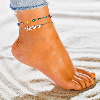women wearig siver Layered Nameplated Evil Eye Anklet Chain
