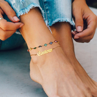 women wearing gold Layered Nameplated Evil Eye Anklet Chain