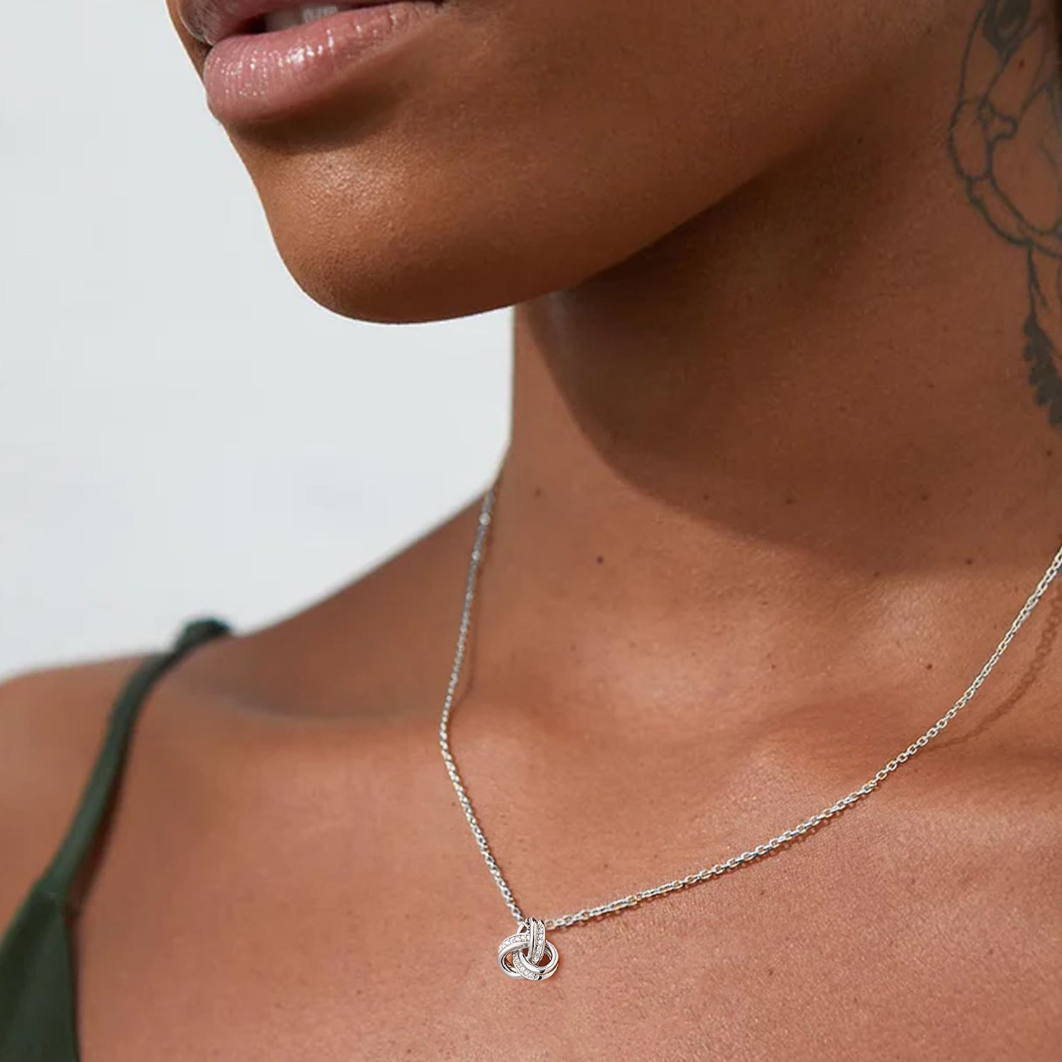 women wearing 925 Sterling Silver Triple Love Knot Necklace 