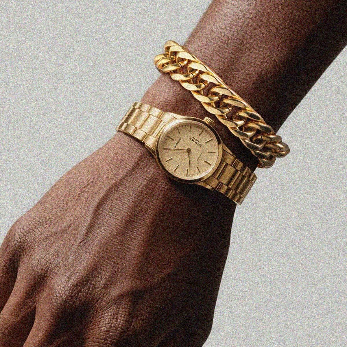 man wearing gold Cuban Link Curb Chain bracelet