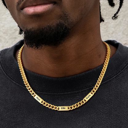 man wearing gold name chain