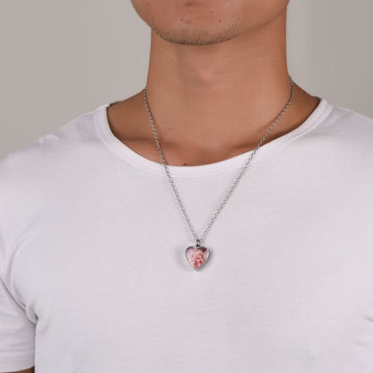 man wearing silver heart urn necklace