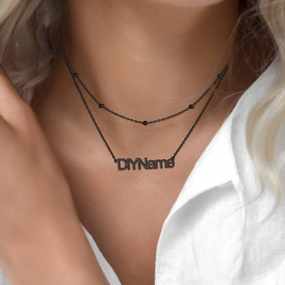 woman wearing black name necklace