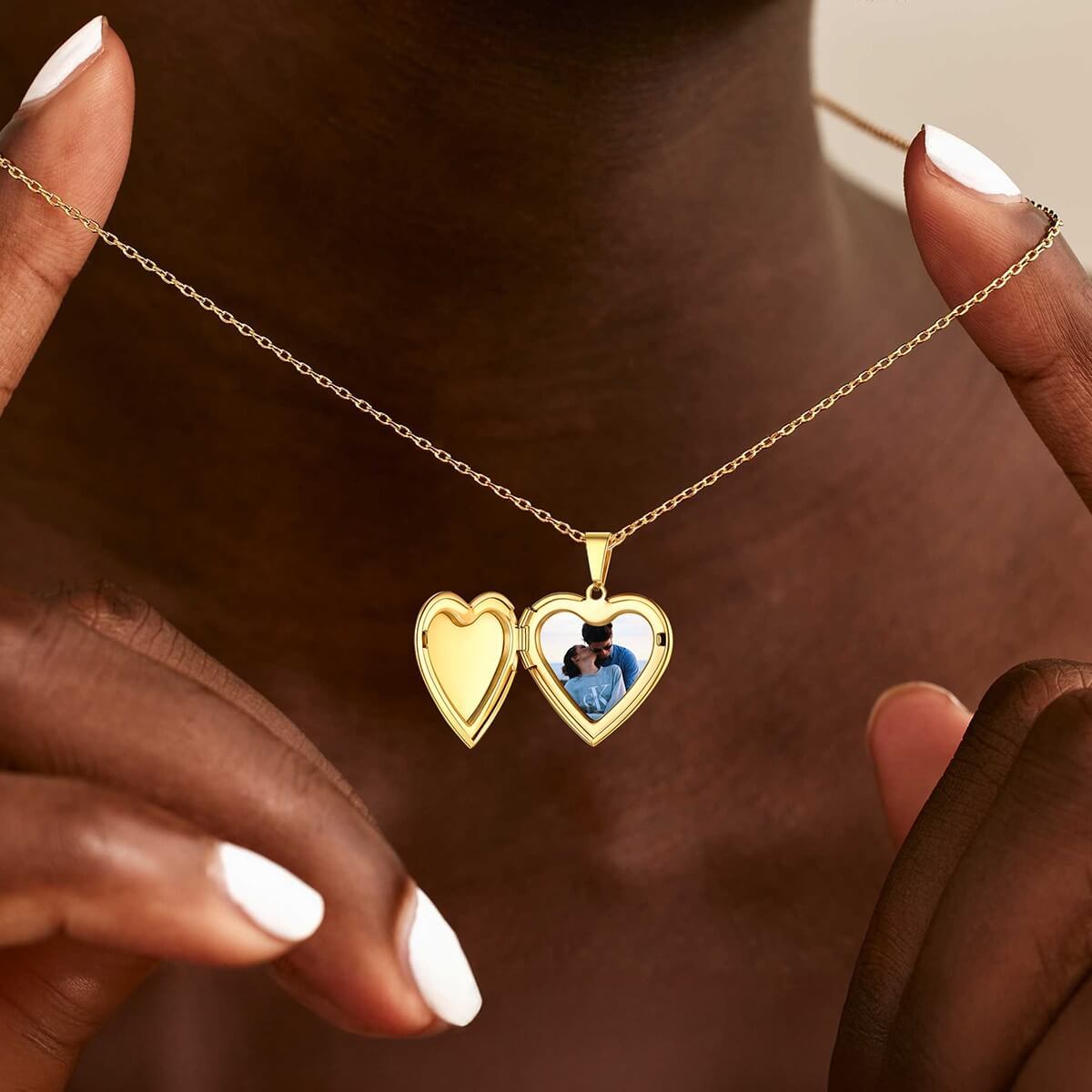 woman wearing gold locket