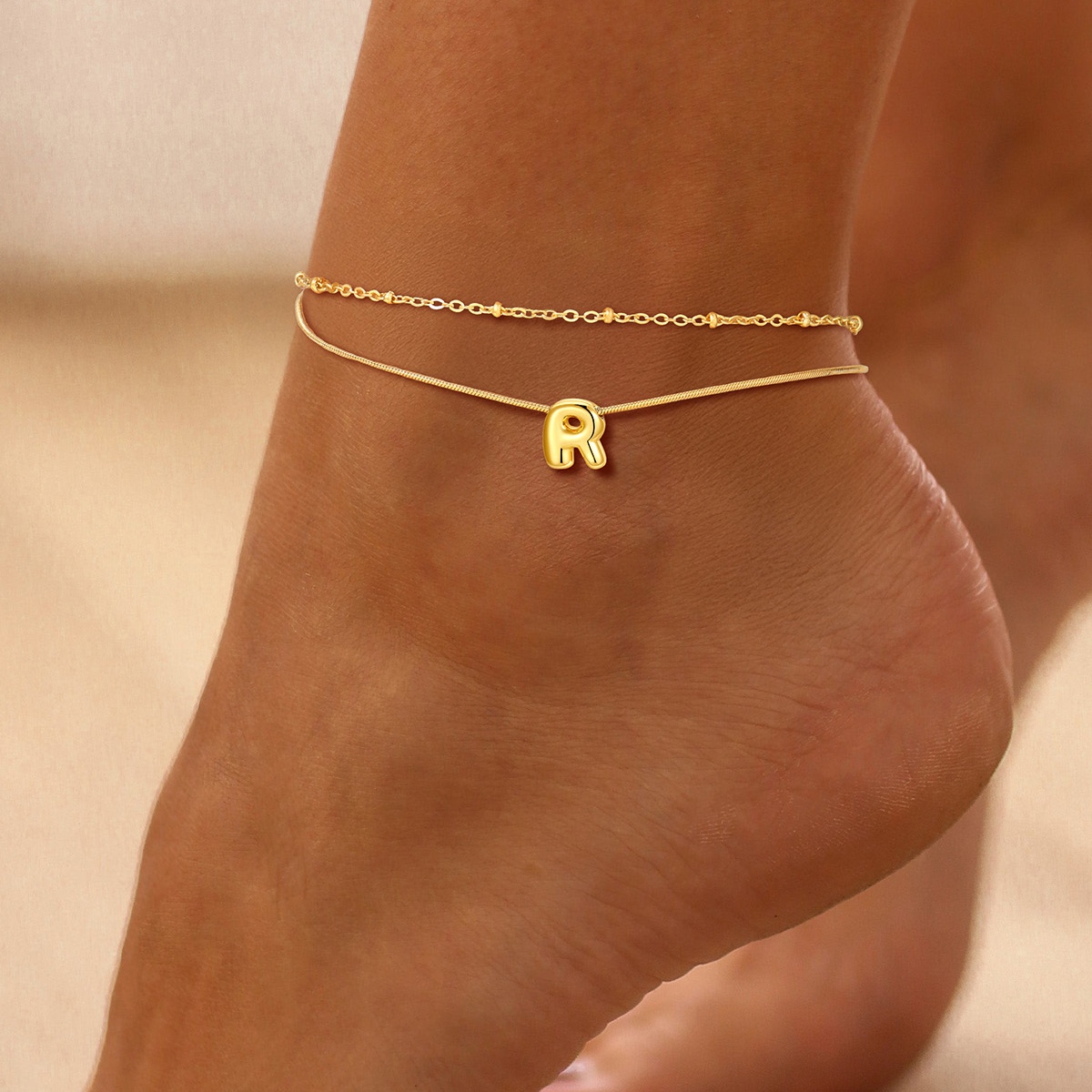 women wearing Gold Bubble Letter r Anklet Chain 