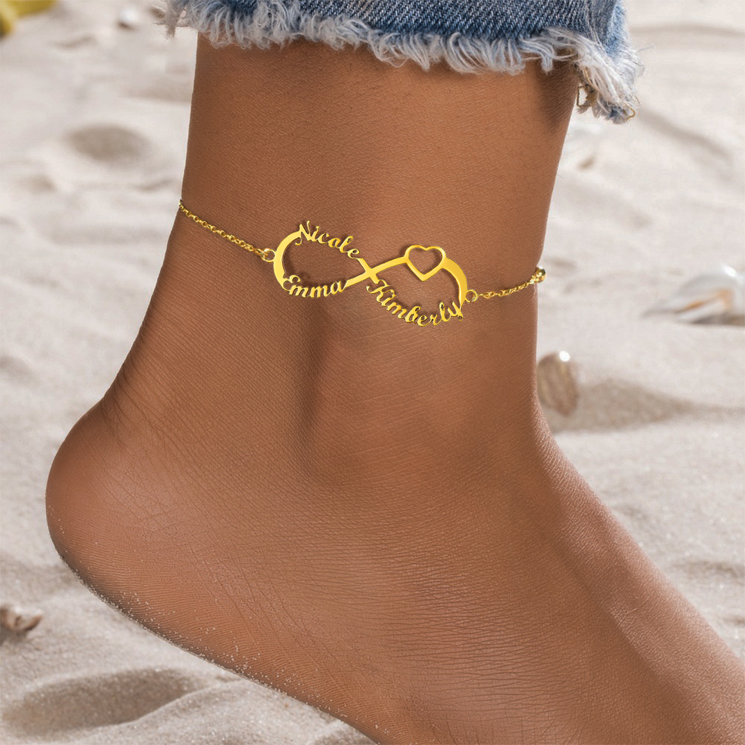women wearing gold infinity name anklet
