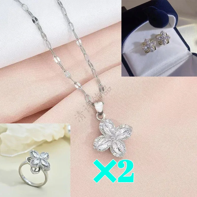 Drehbares Set aus Halskette, Ring und Ohrringen mit vierblättrigem Glückskleeblatt