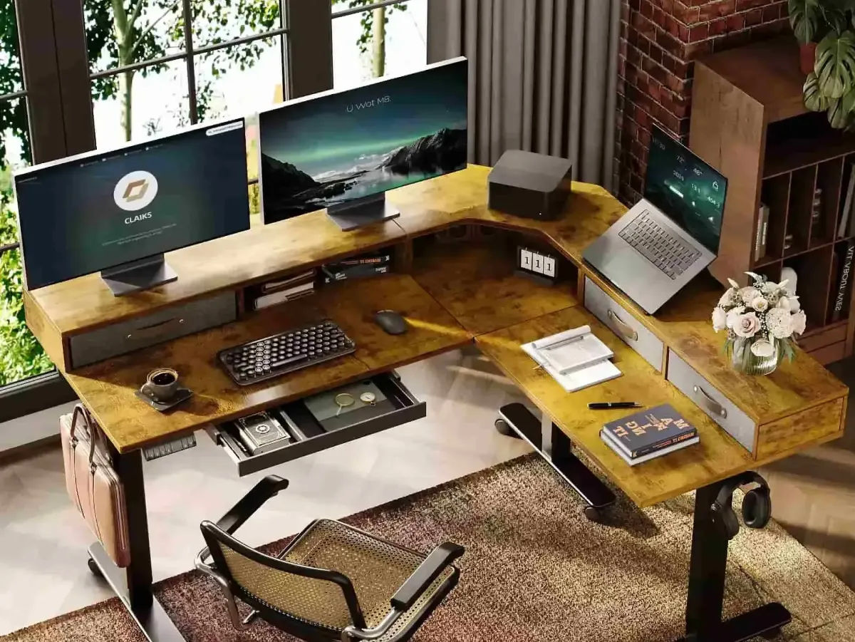 Stylish home office setup with a wooden corner desk, dual monitors, a laptop, and organized workspace elements.