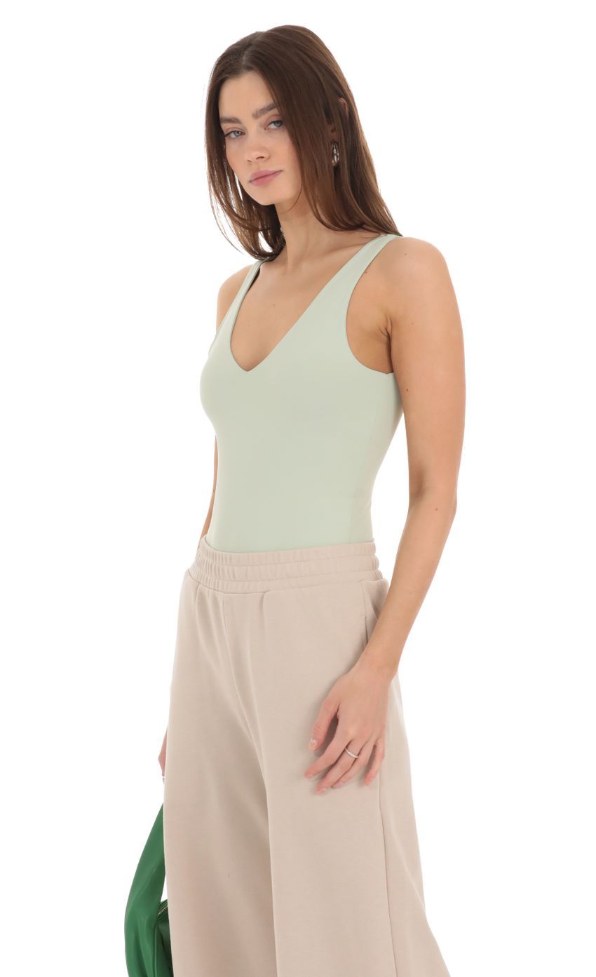 V-Neck Bodysuit in Pistachio-Sunny Prom. All rights reserved.