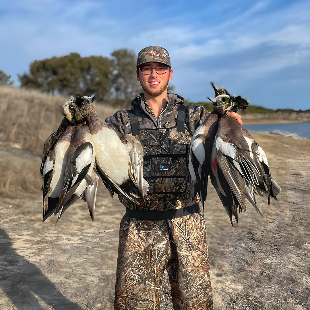 The hunter happily displayed his catch