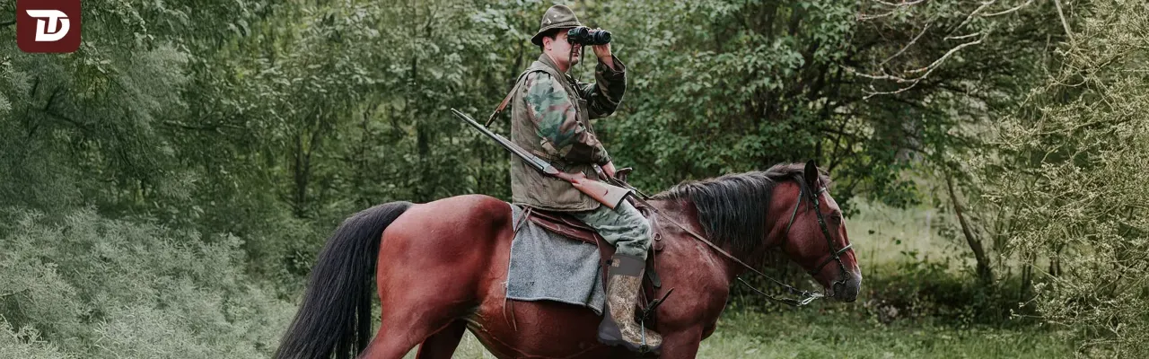 The hunter sat on his horse and searched for his prey