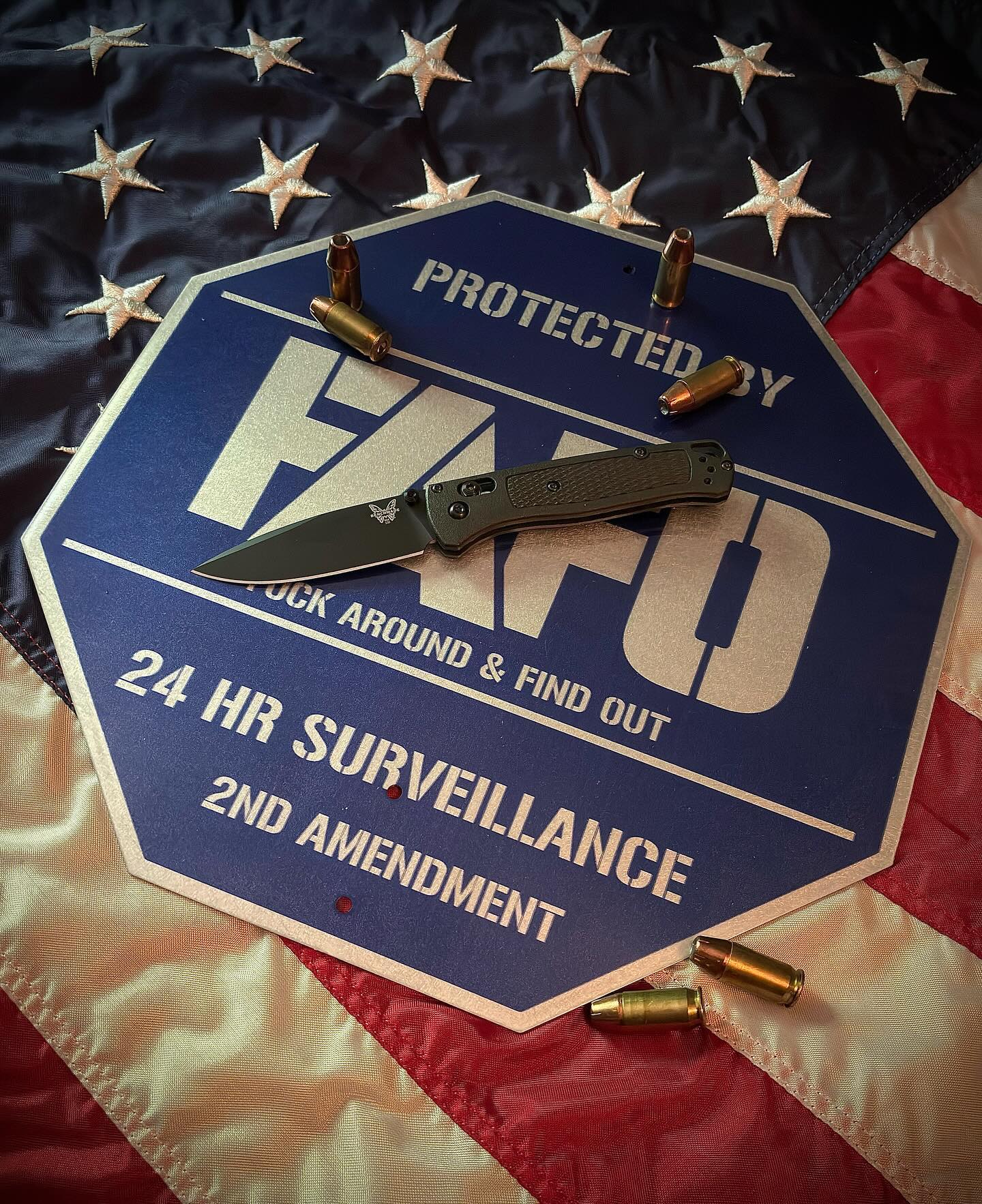 FAFO sign with flag and bullets