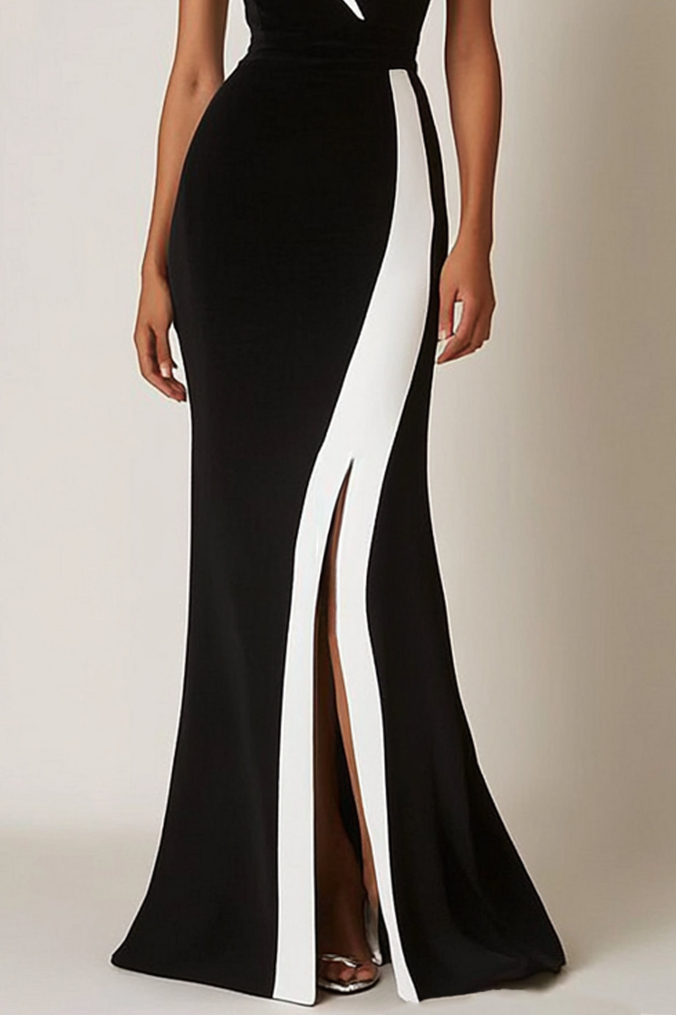 Back view of the black and white halter dress, ideal for upscale galas or evening events.