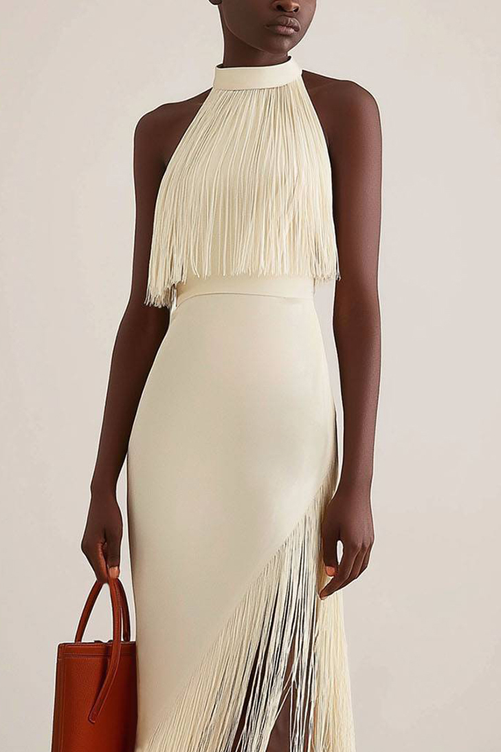 Fringe halter cocktail dress on hanger, displaying the neckline and soft drape—great for stylish and confident women.