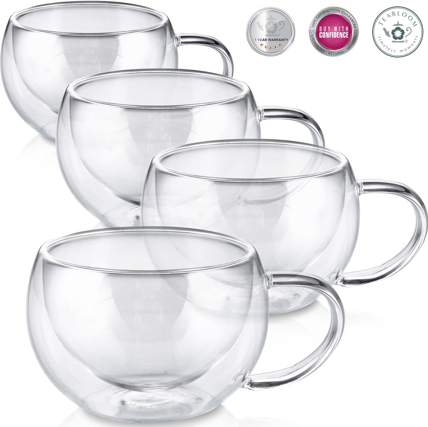 Four empty 6 oz clear glass cups with rounded handles