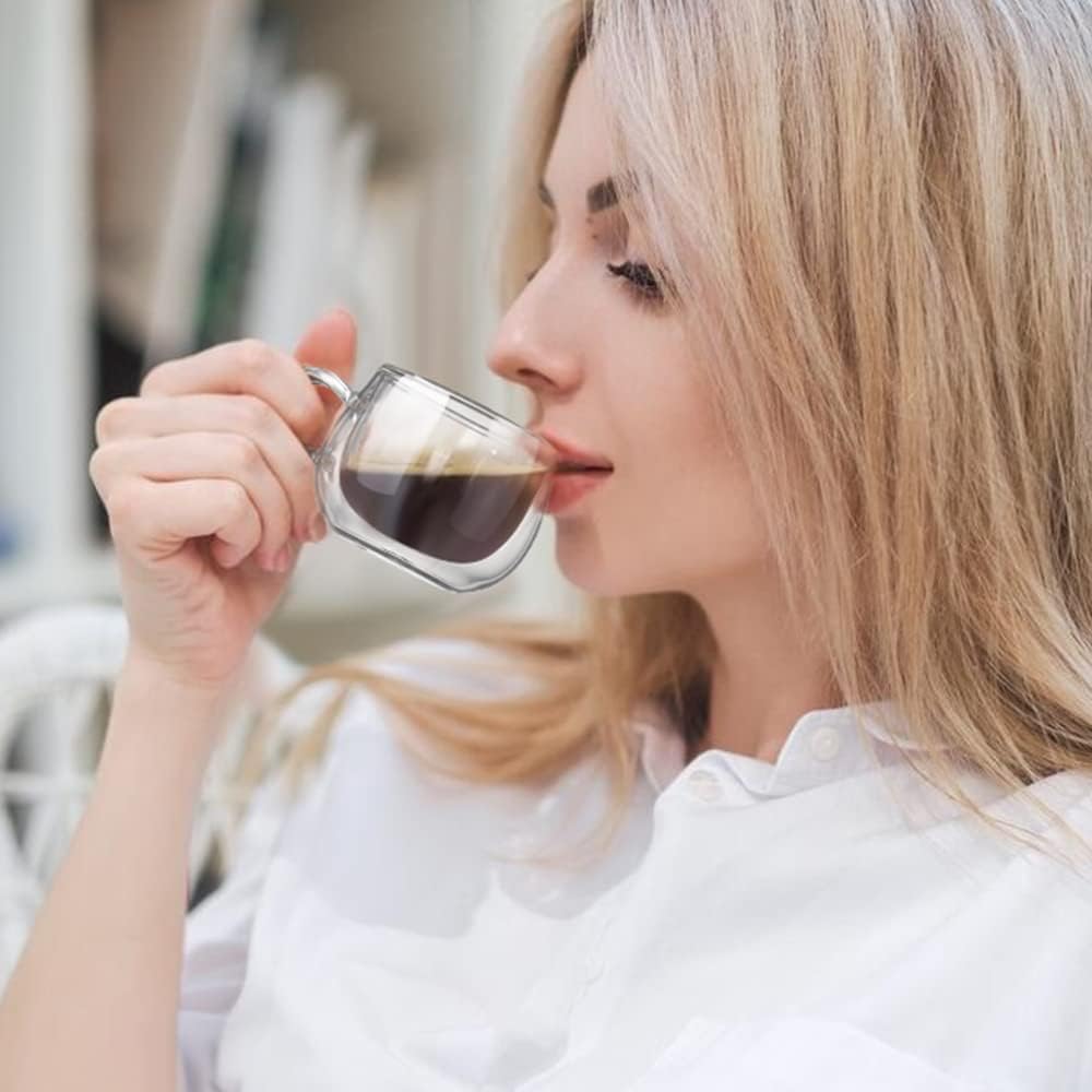 Small 4 oz handled espresso cup being used for a sip