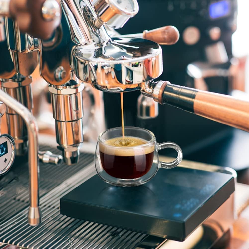 4 oz handled espresso cup placed under an espresso machine