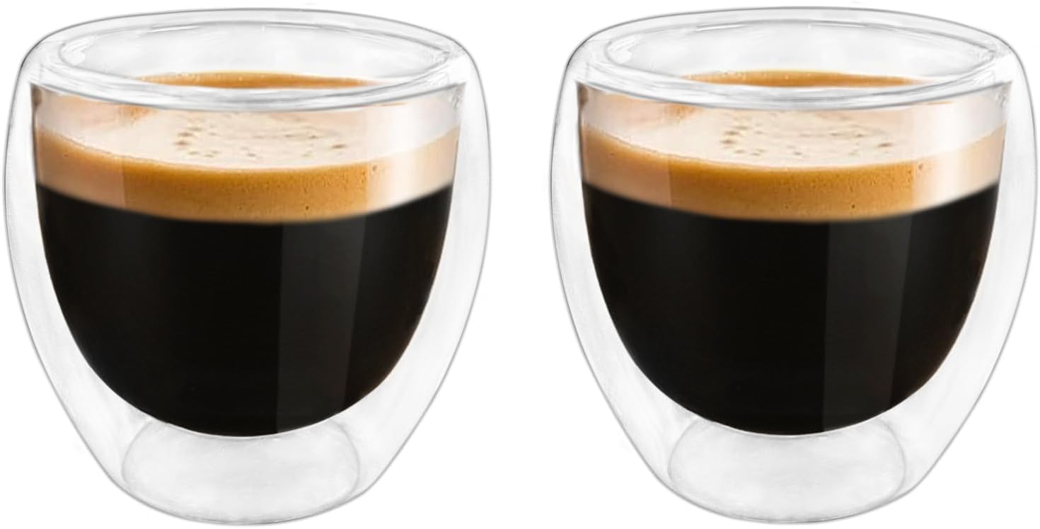 Set of two clear 3 oz double wall glass espresso cups filled with espresso