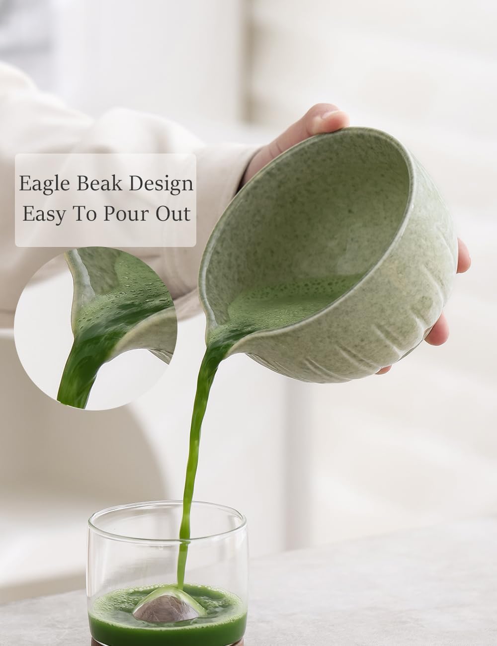 Ceramic matcha bowl with pouring lip pouring whisked matcha