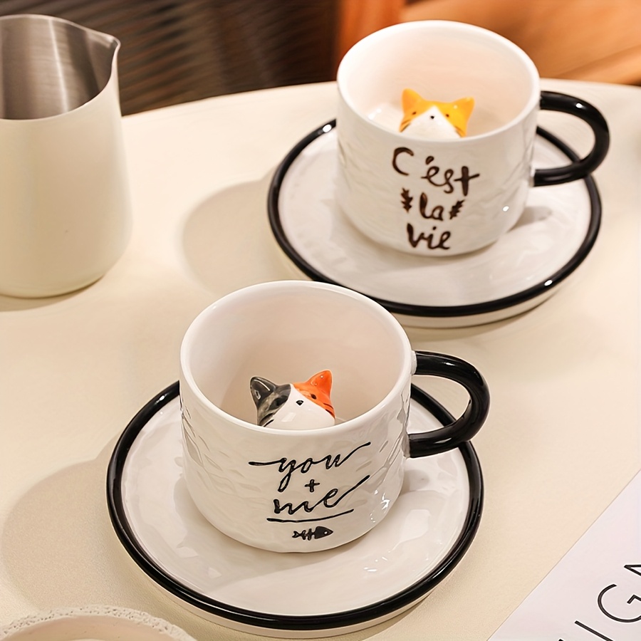Ceramic cat inside cup set for coffee or tea