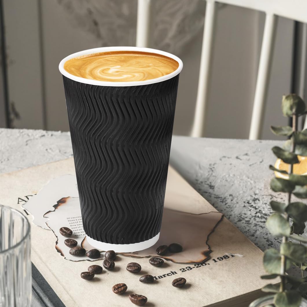 Single black ripple wall paper hot cup with lid on a tabletop