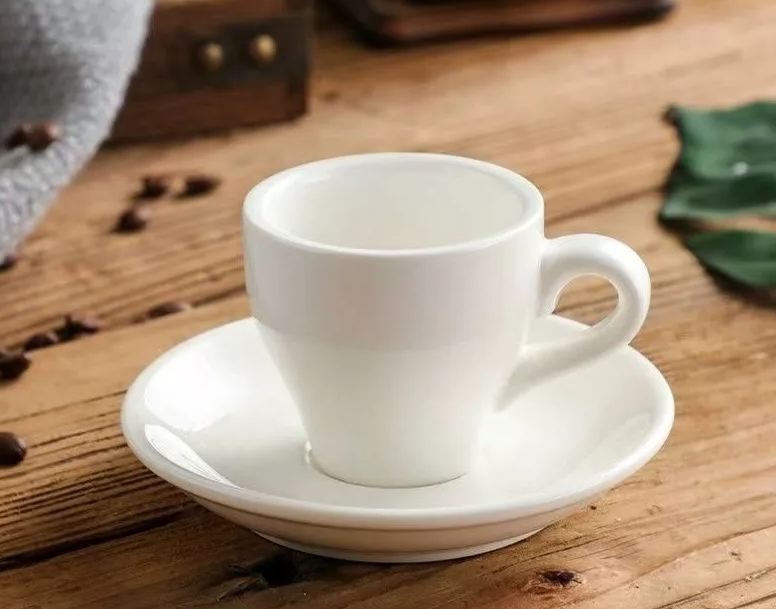 White ceramic 2.5 oz espresso cup with matching saucer