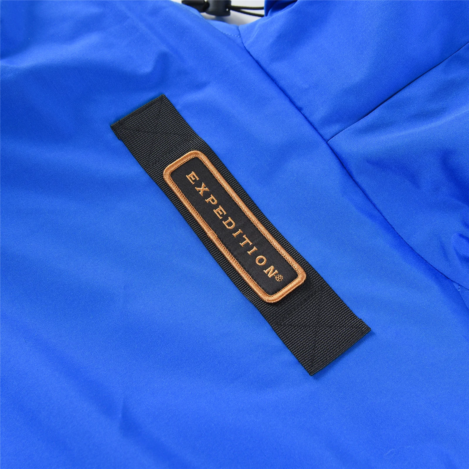 カナダグース エクスペディション パーカー 4660M、ユニセックス ダウンジャケット、ミドル丈コート（ブルー）。