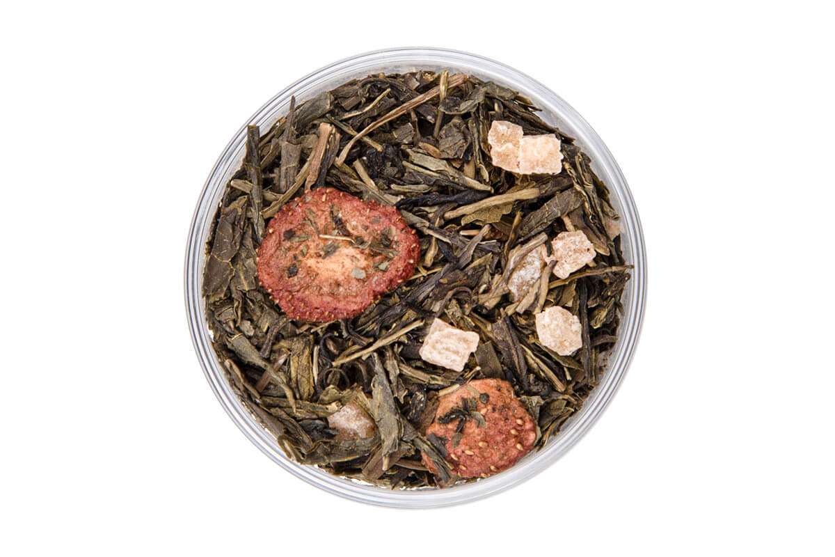 Loose Tropical Green tea leaves with pineapple pieces, strawberry slices, and peach 