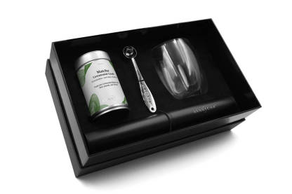 Opened Matcha Latte Gift Set showing AVANTCHA Matcha Ceremonial Grade Kagoshima tin, double-walled glass, electric whisk, and matcha spoon in a premium gift box.