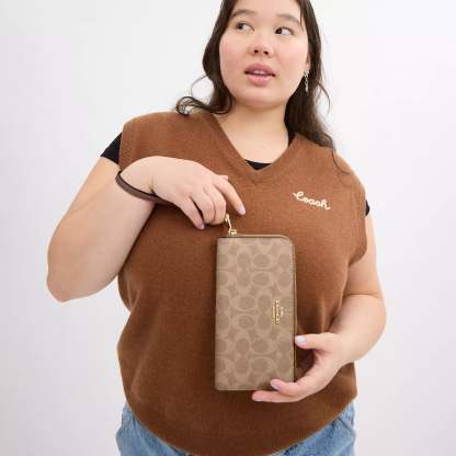 Coathtch Outlet Long Zip Around Wallet In Signature Canvas