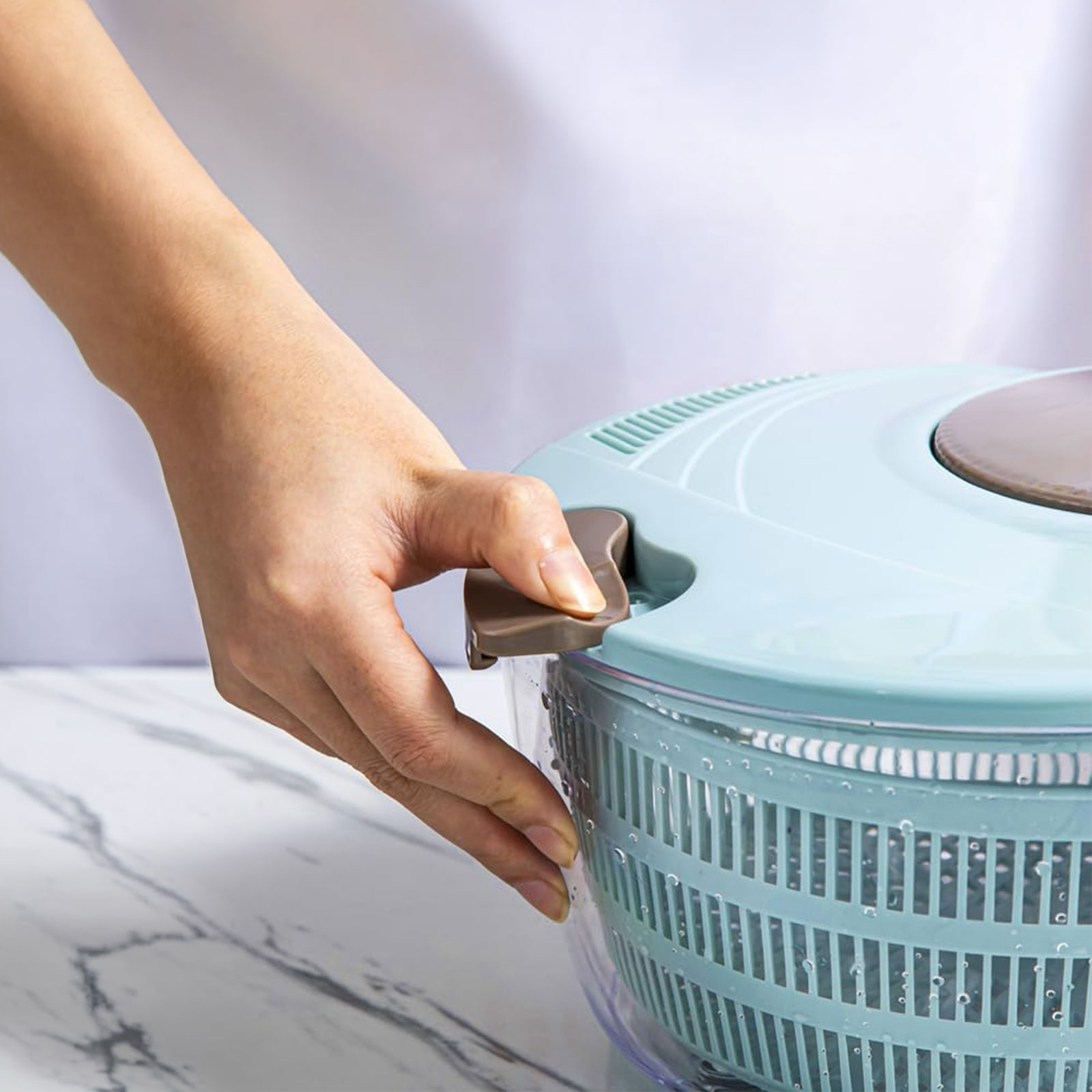 salad spinner used as fruit washer with strawberries and grapes