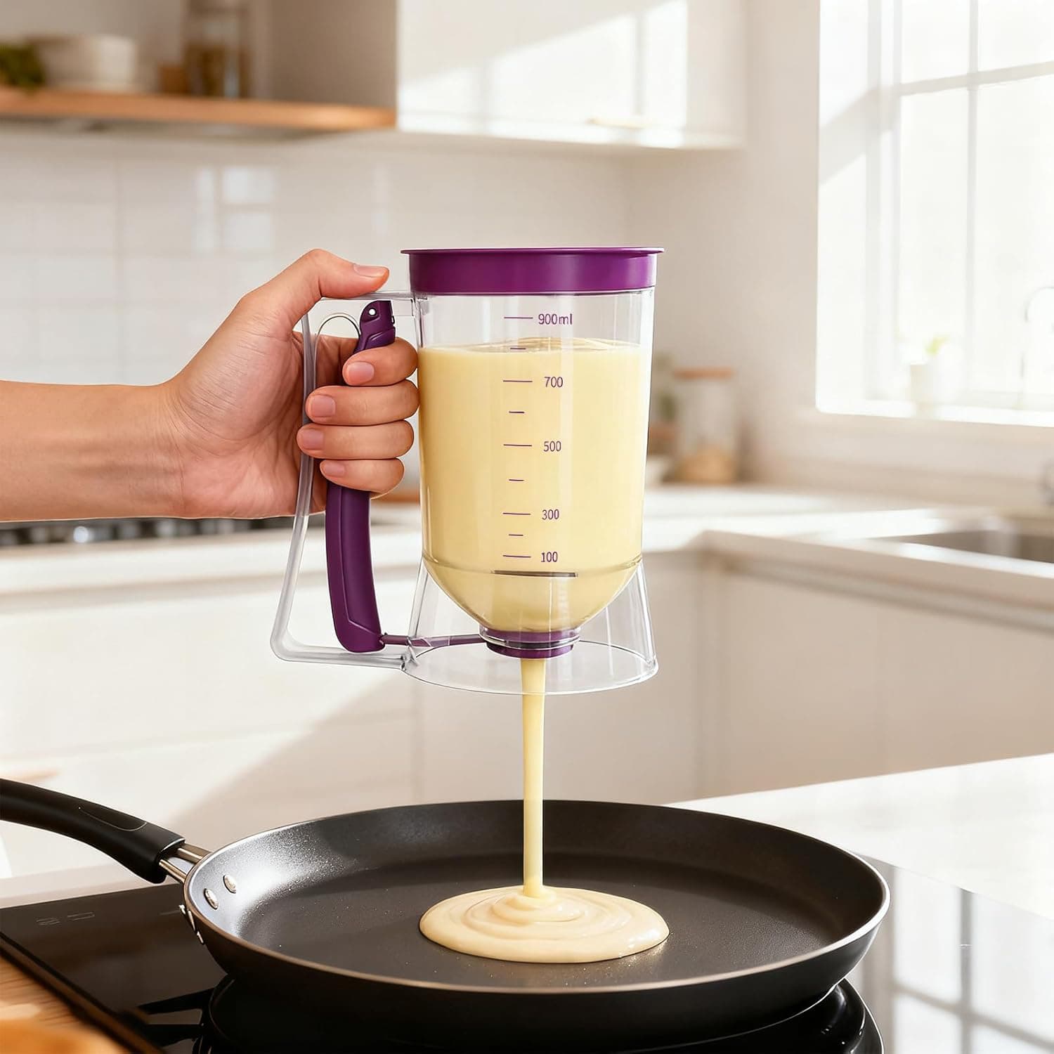 batter dispenser pouring perfect round pancakes on griddle