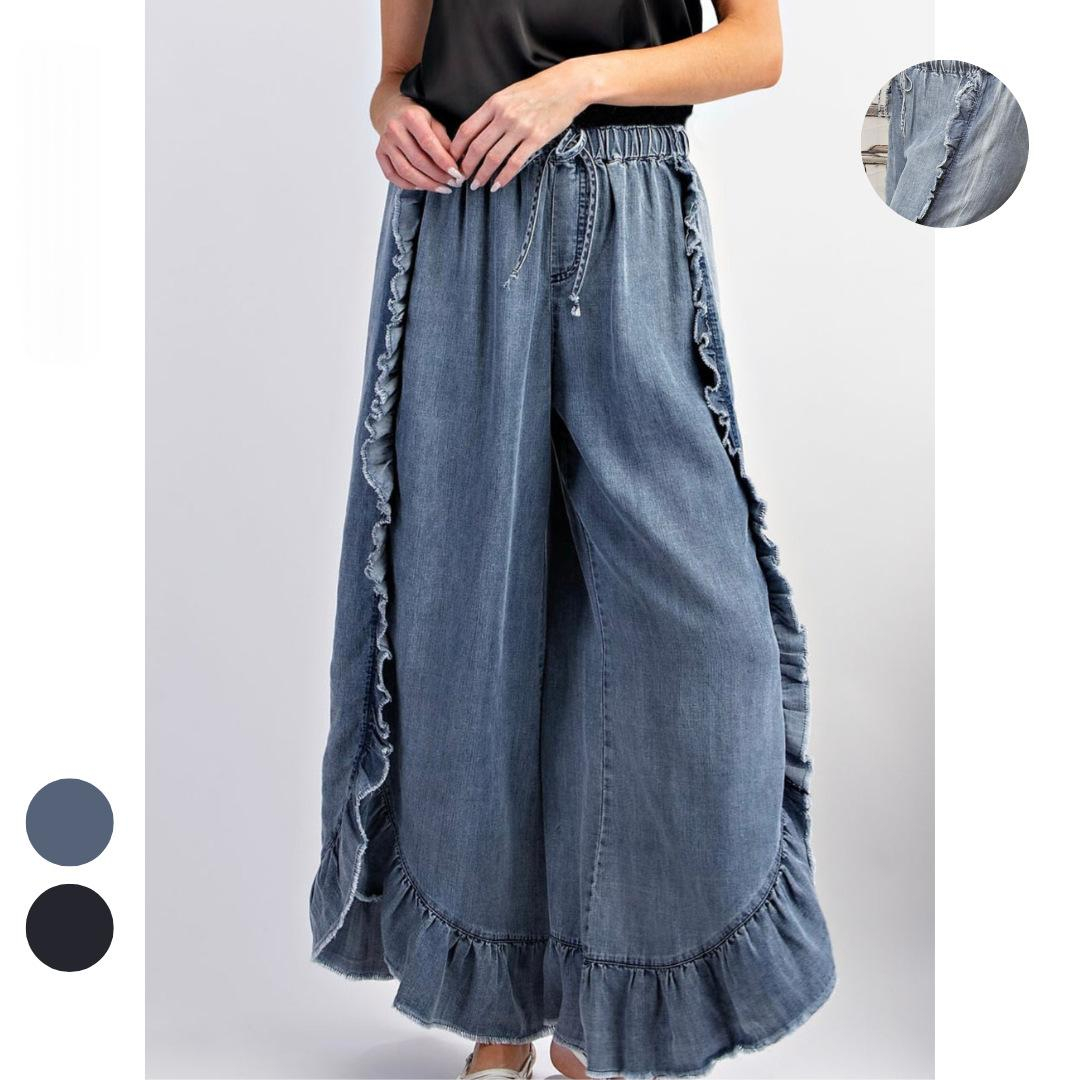 Women's washed denim wide-leg flared pants with ruffle hem – front view showing flared silhouette and ruffle side trim