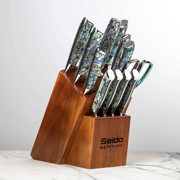 Awabi knives stowed inside the acacia block - white background