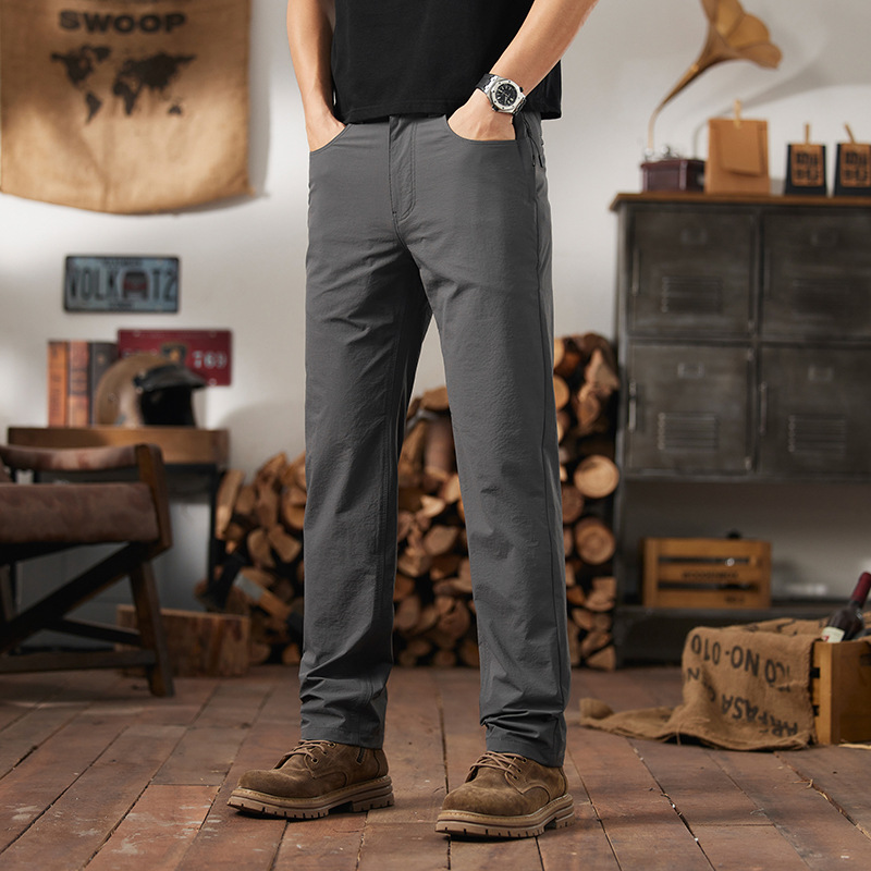 Front view of AFTCO Honcho men's everyday utility pants in dark gray with deep front pockets and a stylish modern cut.