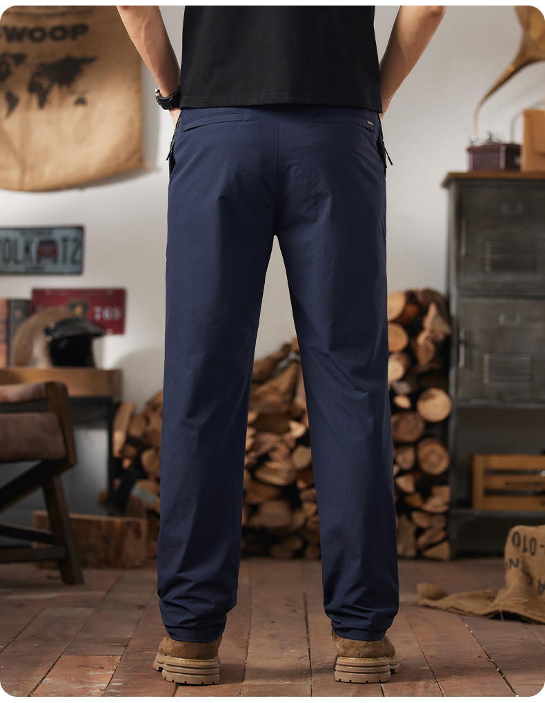 Back view of AFTCO Honcho stretch utility pants in navy blue, showcasing the comfortable fit and clean rear pocket design.
