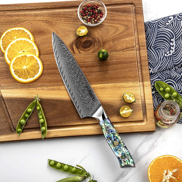 Awabi series Chef knife displayed on a cutting board with ingredients