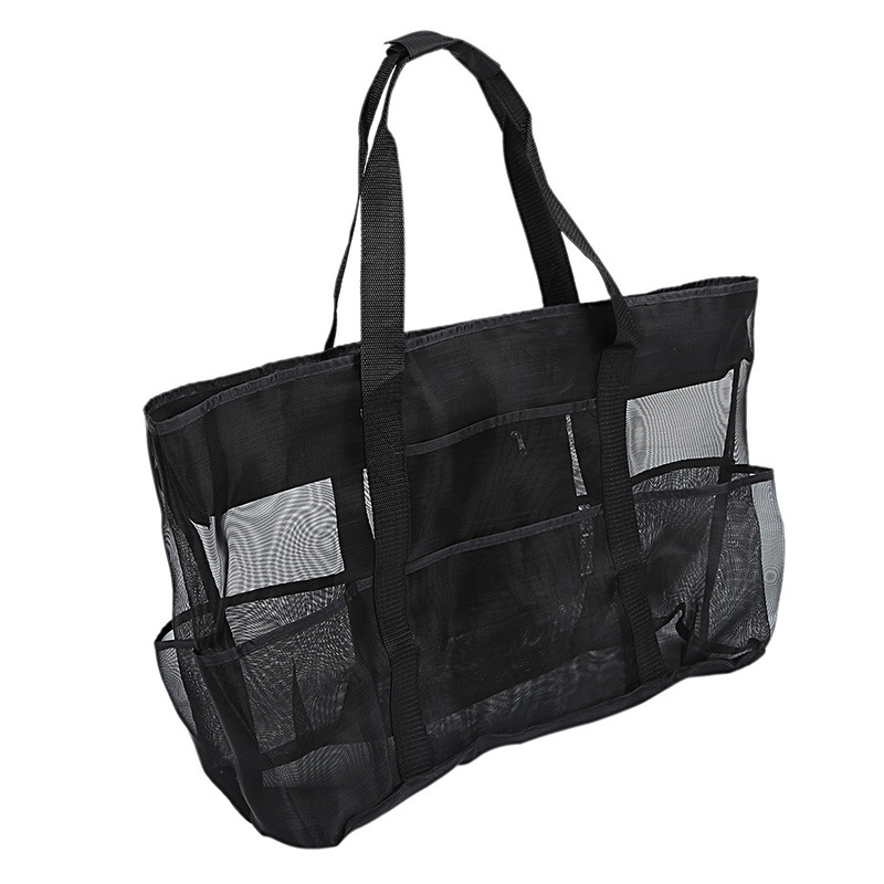 Side view of the black Duck Camp mesh tote bag, highlighting the spacious main compartment and multi-pocket organization.