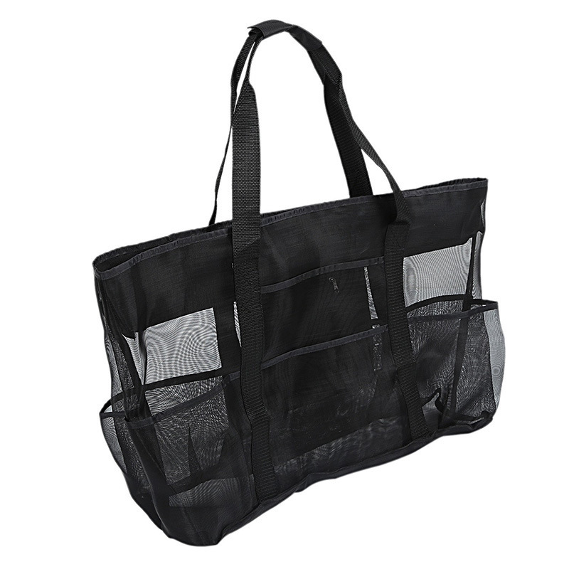 Side view of the black Duck Camp mesh tote bag, highlighting the spacious main compartment and multi-pocket organization.