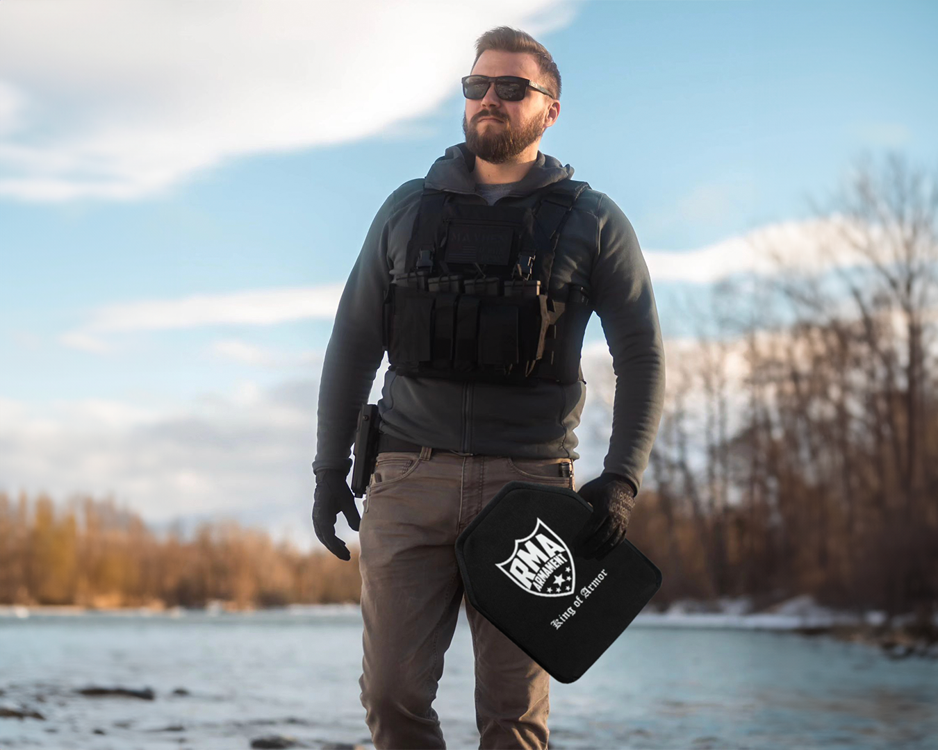 A man holding RMA Defense NIJ .06 Certified Body Armor Level 4 Plates Set (Model #1155)