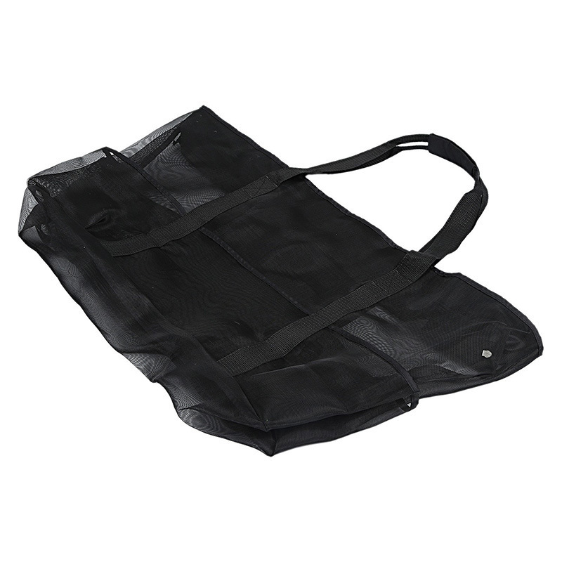 An empty black mesh gear tote bag laid flat to show its lightweight, packable, and foldable design for easy travel storage.