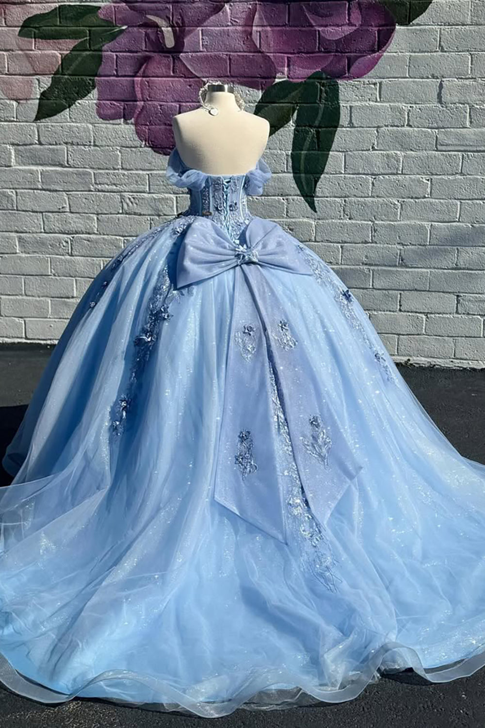 Off the Shoulder Blue Princess Organza Quinceanera Dress Featuring a Bow and Applique