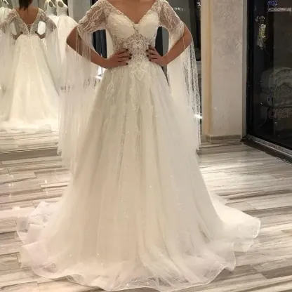 Gorgeous Short Sleeves Backless Floor-Length A-Line Deep V-Neck Wedding Dress with Appliques Lace Pearl