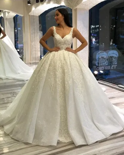 Stunning Spaghetti-Straps Sequins Backless Ball Gown Sweetheart Wedding Dress with Appliques Lace