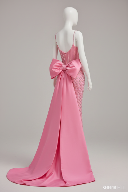 Close-up of oversized pink satin bow detail