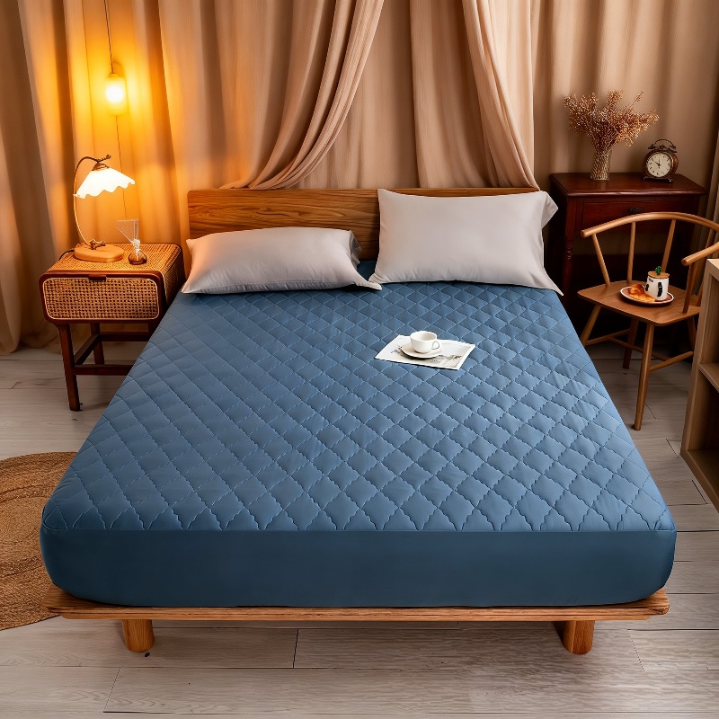 Spill-proof mattress protector in bedroom setting