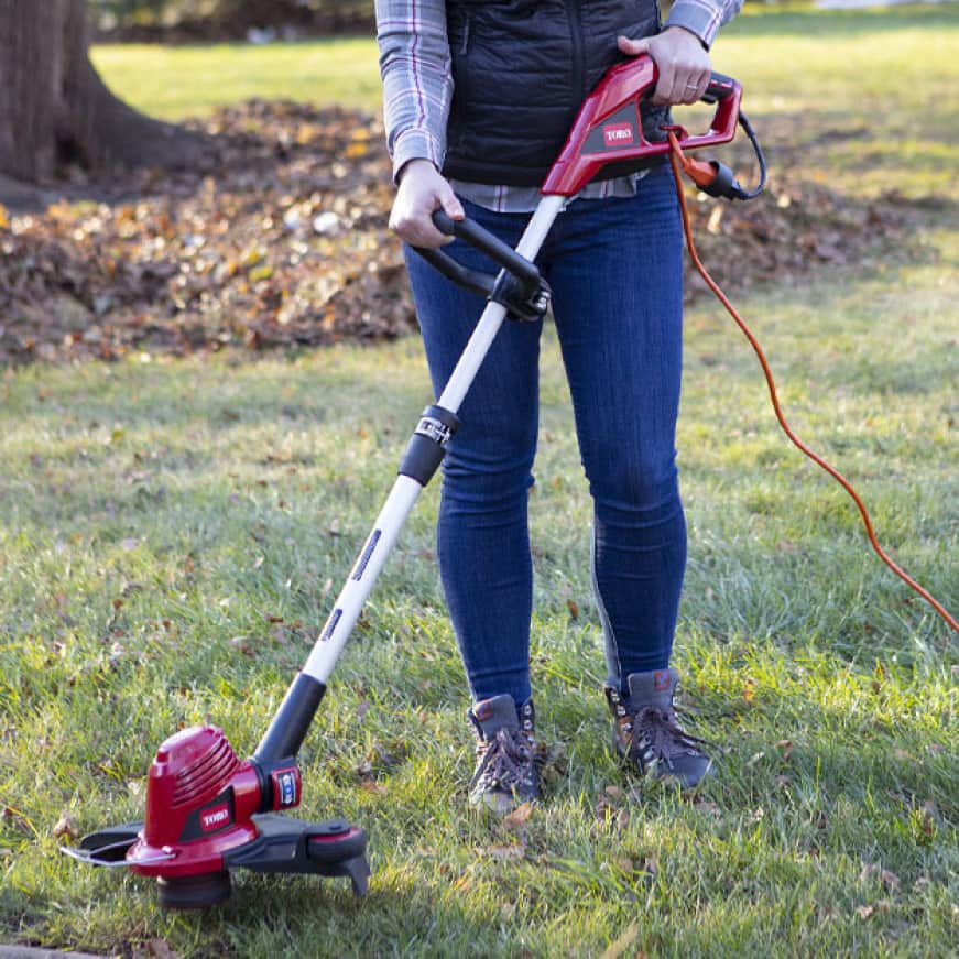 Corded Trimmer Easily Cutting Through Thick Grass
