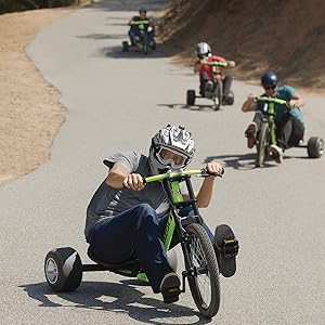 Razor; Three Wheeled: Four Guys Riding Down Street Hill