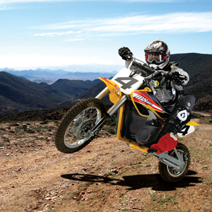 Razor; MX650; Electric Motorcycle; Rider with front wheelie on dirt